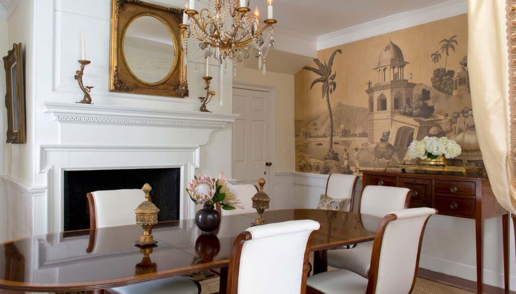 Traditional dining room with antique table and layered florals, Charleston interior design by Alexandra Howard